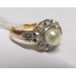 A gold pearl and diamond cluster ring