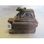 An Argentinean carved box with bullock to swivel lid