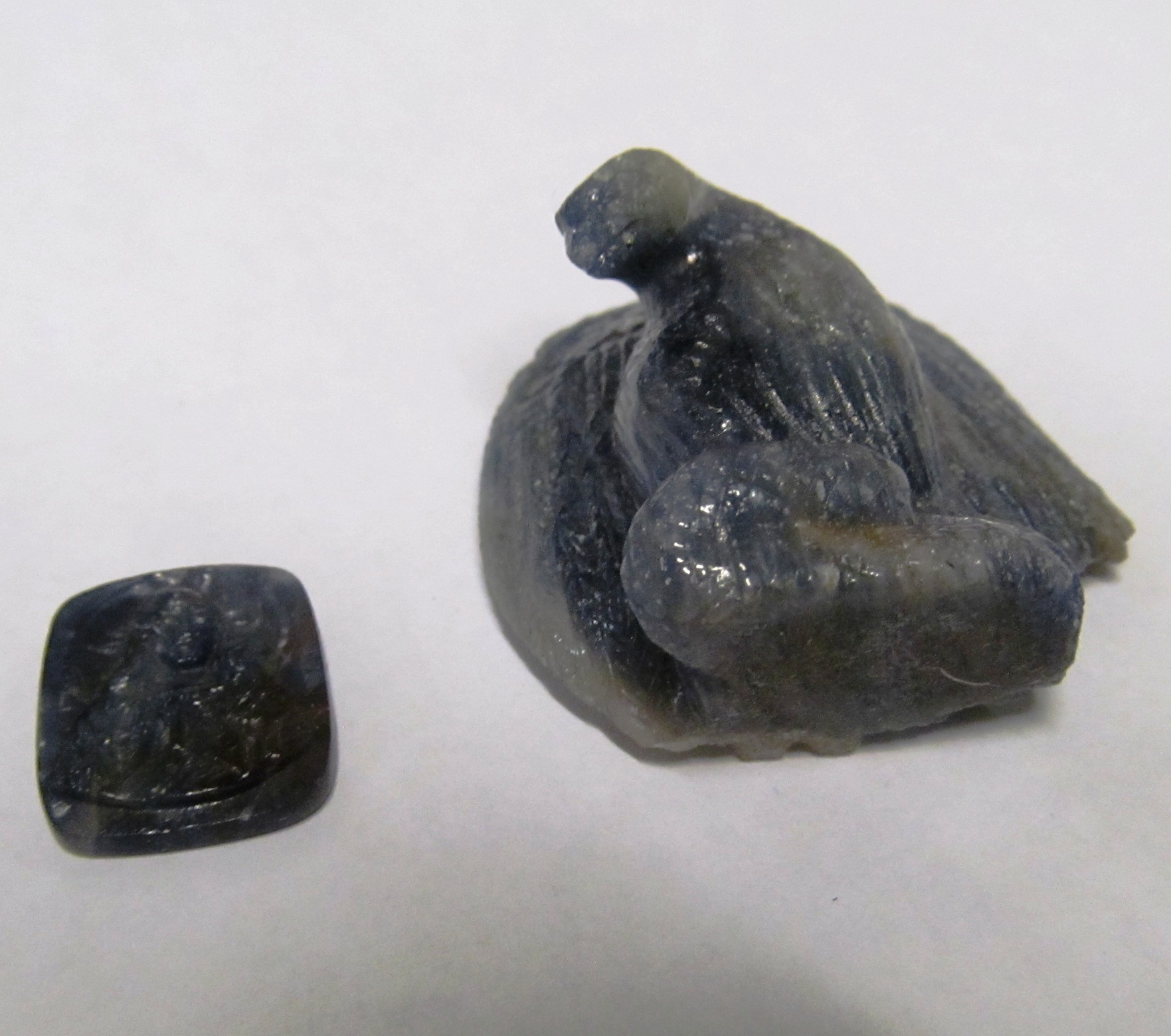 Carved blue stone eagle (sa/f) and a carved small stone Jesus
