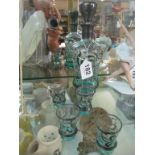 A turquoise and silver overlaid liquer decanter and four glasses