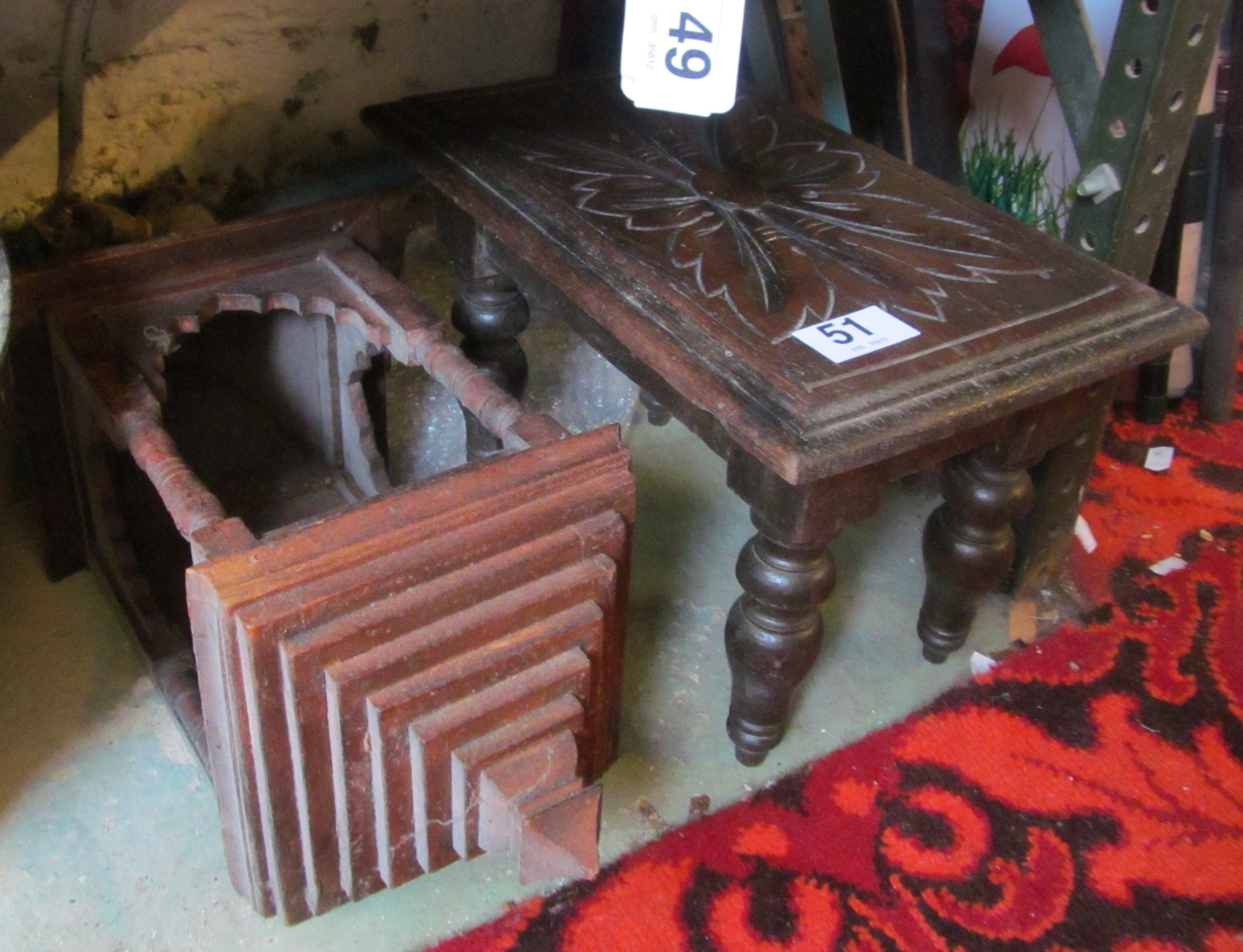 A small oak stool and a wall hanging candle holder