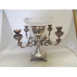 A large Victorian silver plated centre piece with four branch candle holders embossed vines and