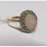 A 9ct opal and diamond cluster ring
