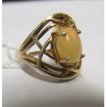 A silver gilt ring set opal style stone