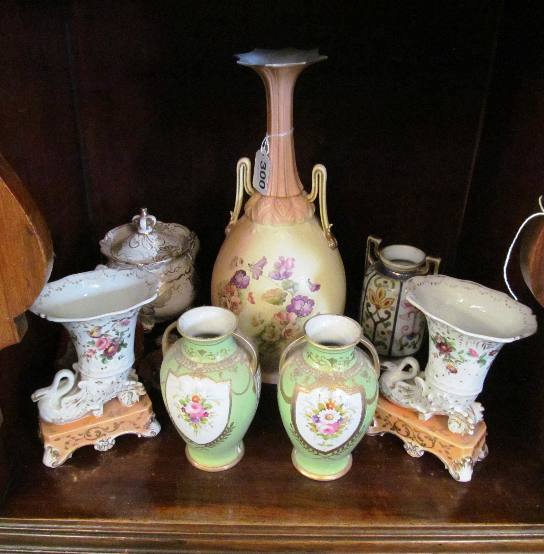 A Worcester style vase decorated flowers, pair of green glazed vases hand painted flowers and a