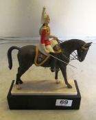 A Royal Worcester military equestrian figure 'The Lifeguards' by Doris Lindner supported in