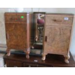 A pair of walnut bedside cabinets on cabriole legs