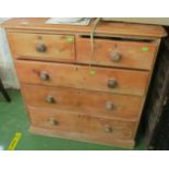 A pine chest of two short and three long drawers