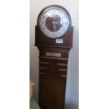 An oak Grandmother clock with presentation plaque 1937