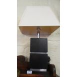 A pair of modern black and chrome block table lamps.