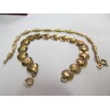 A 9ct gold heart bracelet and another bracelet