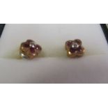 A pair of ruby and diamond earrings