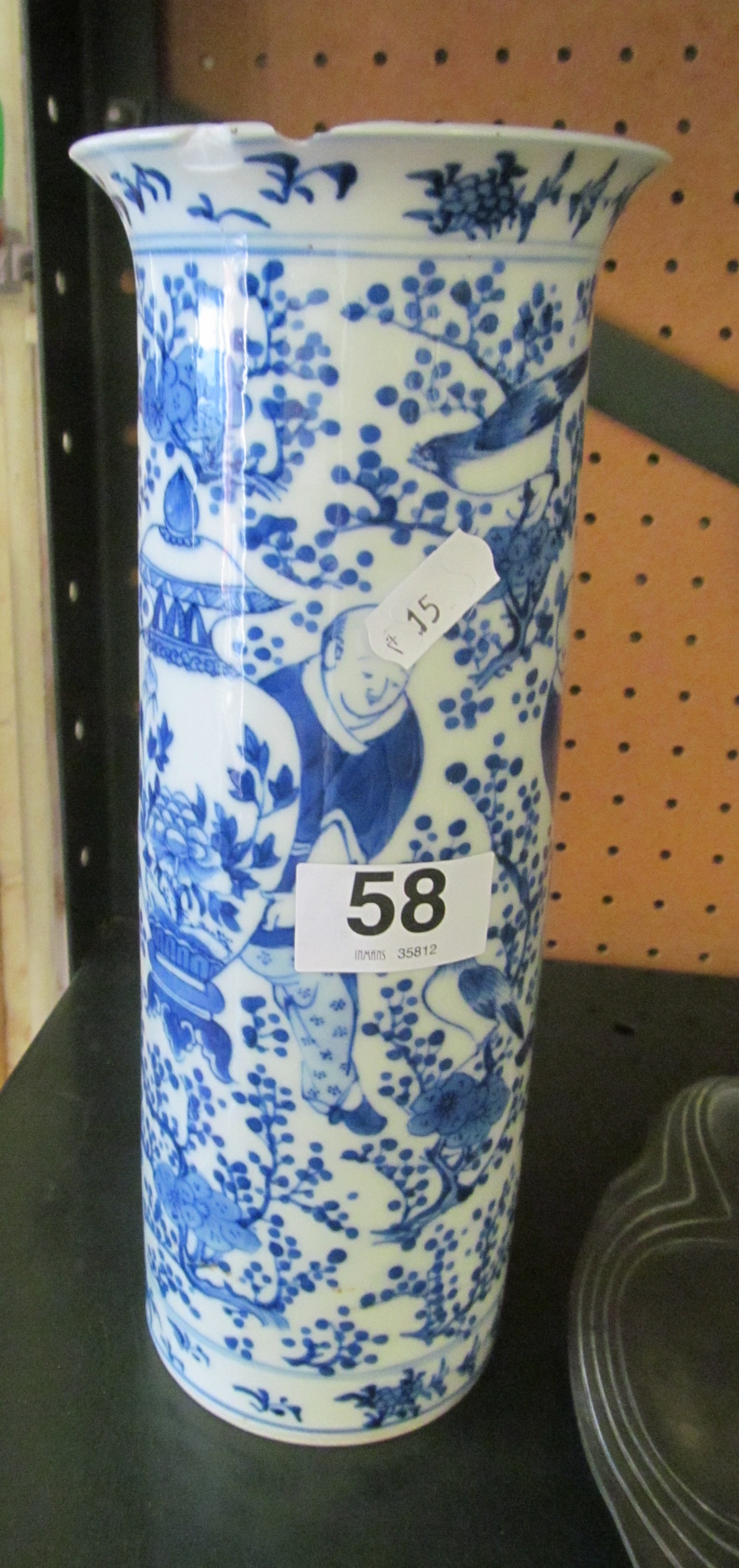 An oriental blue and white vase some damage around neck