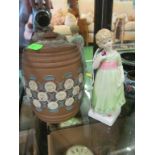 A Doulton Lambeth silicon ware tobacco jar and a Royal Doulton figure Tess