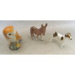 A Beswick owl and donkey and a Royal Doulton dog