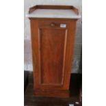 A 19th Century mahogany bedside cabinet with marble top and gallery