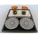 A cased pair of glass dishes and a pair of African scene glasses
