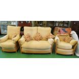 A light wood Ercol three-piece suite