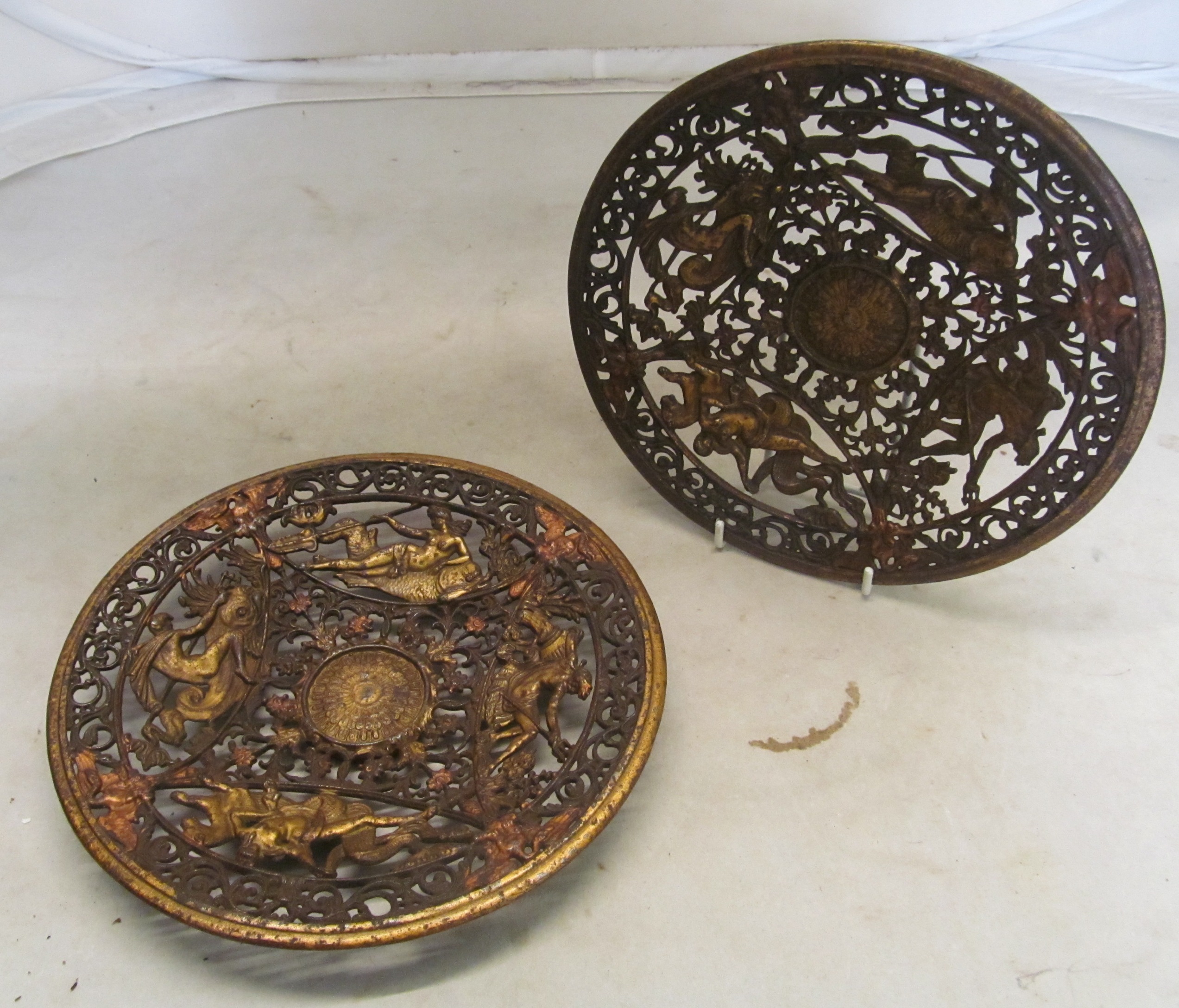 A pair of gilt metal pierced Coalbrookedale style dishes with design of classical figures on