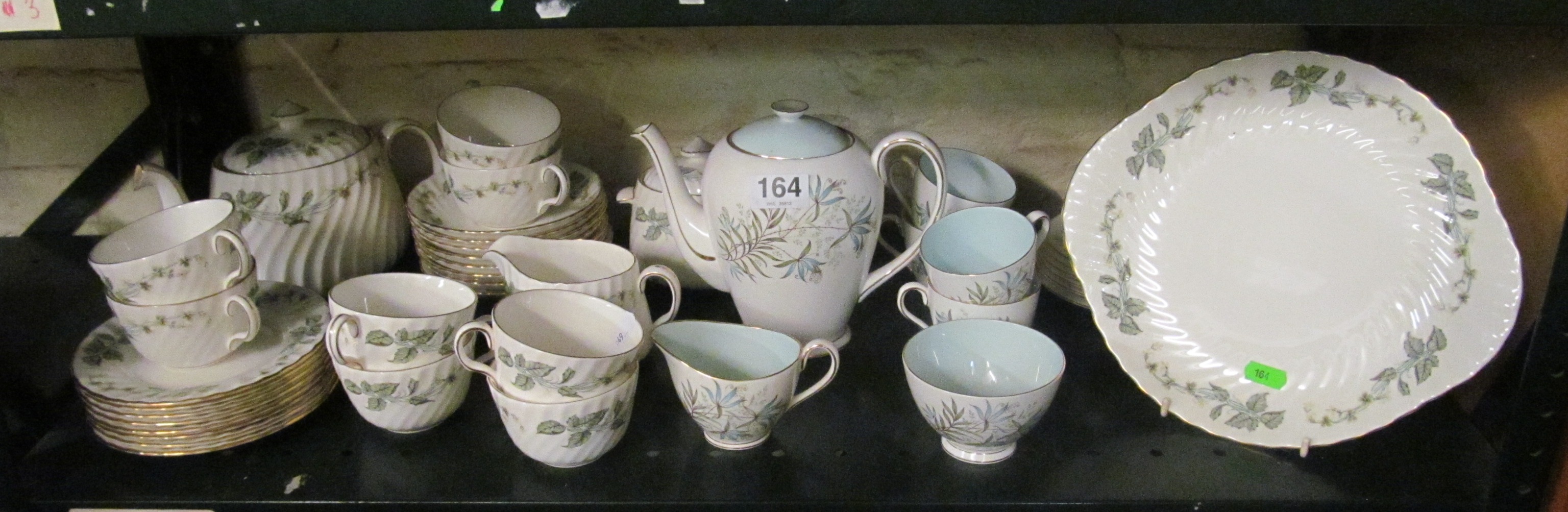 A Tuscan Lily part teaset and a Minton Greenwich teaset.