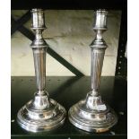 A pair of French plated candlesticks