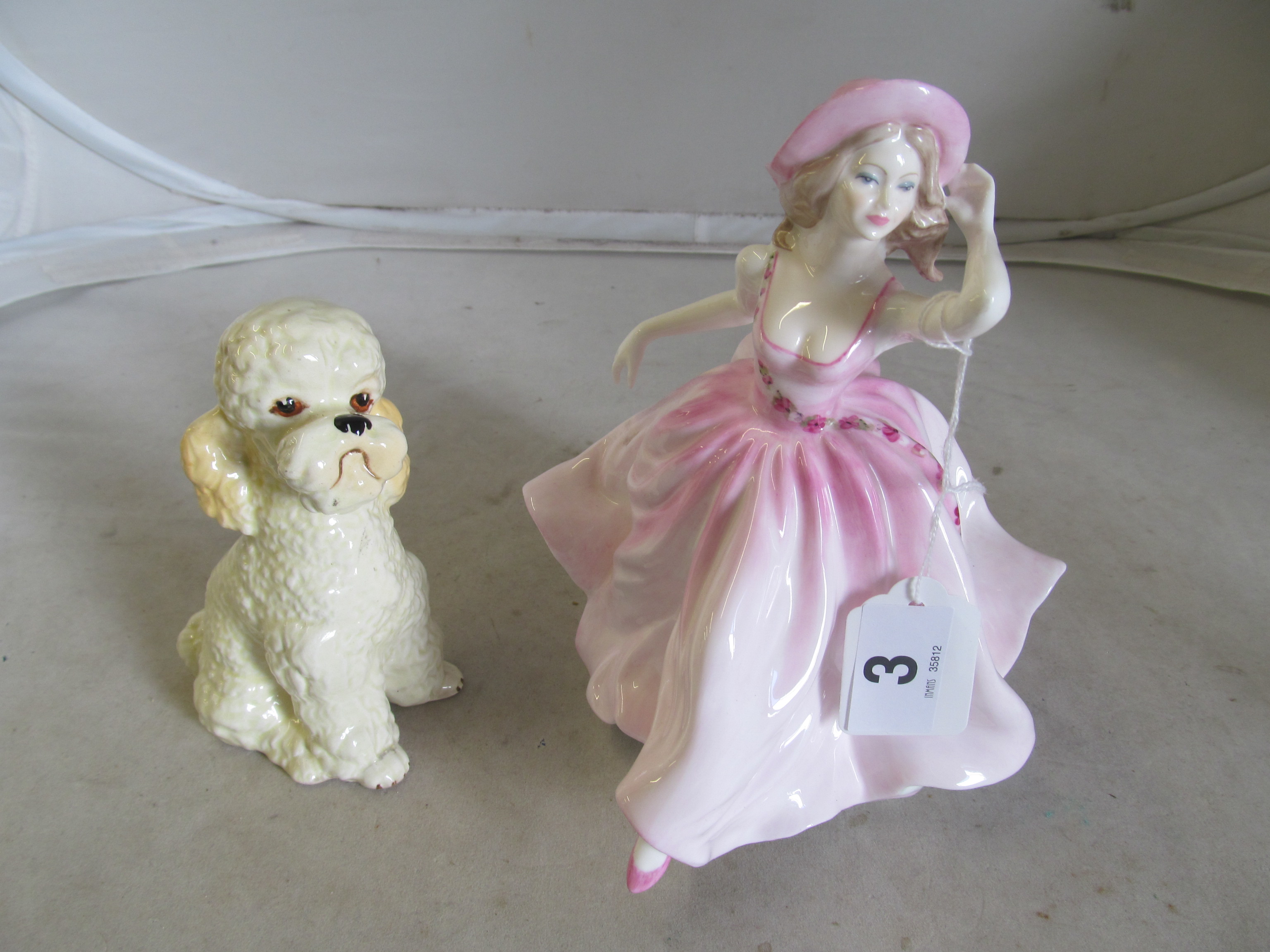 A Coalport figure and a poodle ornament