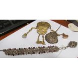 A chatelaine belt clip hung fobs, bracelet with fleur de lys and head design and a hair ornament