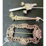 A silver coloured Turban pin, buckle and childs teether