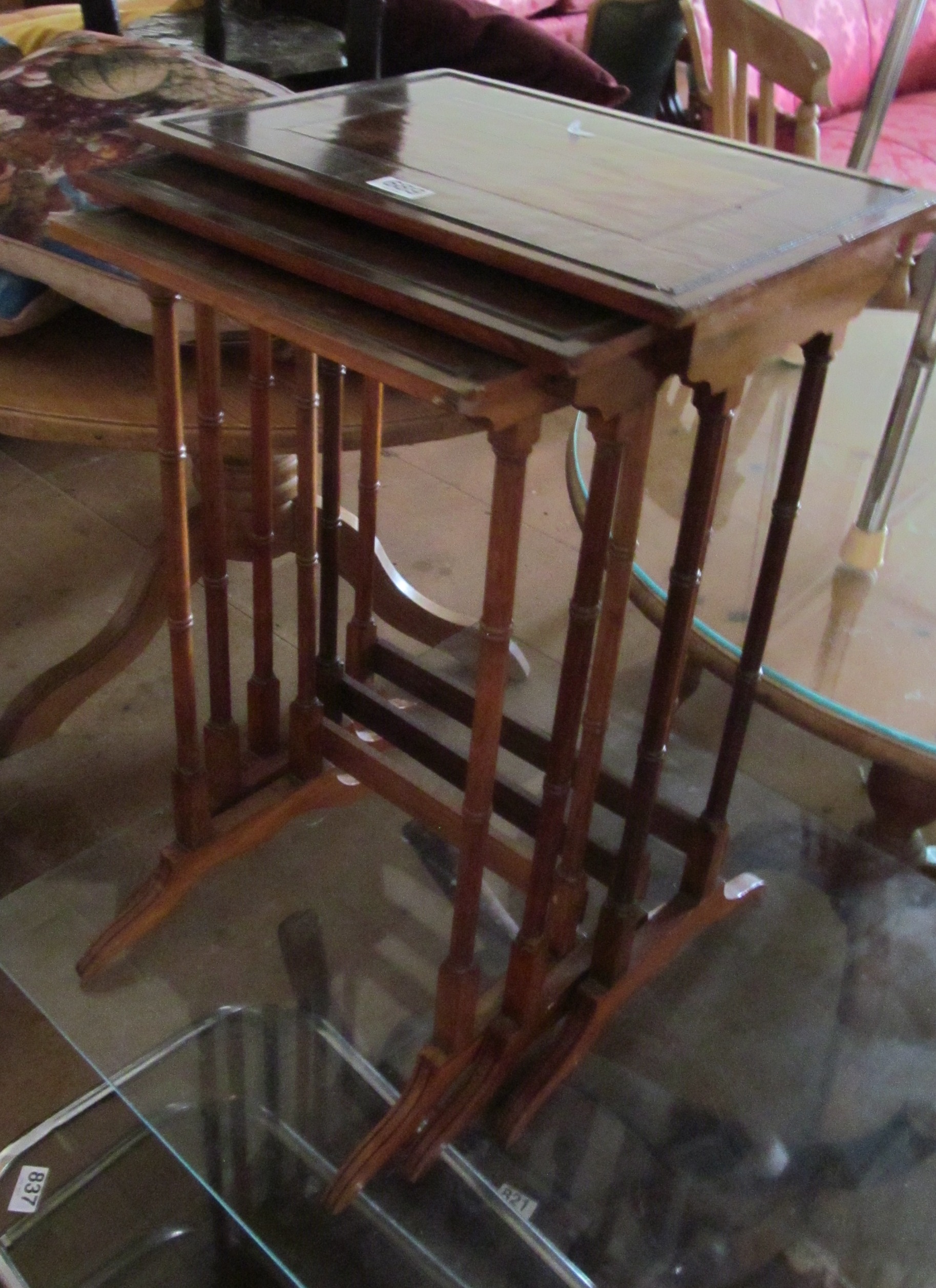 A nest of three mahogany tables (one foot a/f)