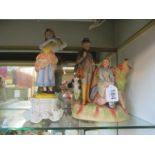 A German bisque figure hunter and lady and another lady holding wheat sheaf