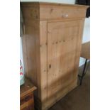 A pine single door cabinet