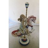 A Lladro girl riding on a carousel horse No 1469 (boxed)