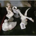 Three Lladro geese, two Nao ducks and a Lladro angel