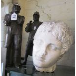 A pair of heraldic plaster figures and a Roman style plaster head (a/f)