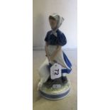 A Royal Copenhagen figure lady with goose