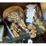 Two gilt cherub wall brackets (1 s/a/f), three gilt cherub ornaments and a white dish supported by