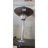 A chrome and copper table top lamp