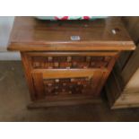 A pine chest with drawer and cupboard