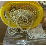 A cultured pearl necklace and other simulated purl necklaces