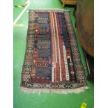 An Afghan rug blue, iron red and cream geometric pattern 63" x 34"