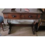 an oak side table with two drawers and lyre ends