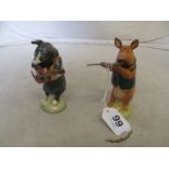 A Beswick pig playing guitar 'Christopher' and another playing flute 'David' (restored)