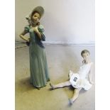 A Nao figure girl with white bonnet and a Nao figure ballerina