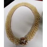 A cultured pearl collar necklace with flower head diamond clasp