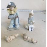 A Lladro boy with sheep, Nao Pierrot playing an accordion and two Lladro children