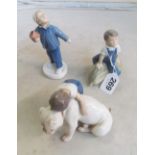 A B & G ornament boy with bulldog, another boy seated on marrow and another boy with flowerpot