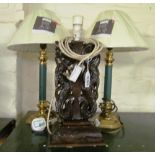 A pair of green and gilt column table lamps and a carved oriental lamp