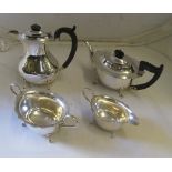 A silver (Sheffield 1931) three-piece teaset, the teapot and hot water jug with ebony knops and