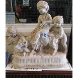 A large French alabaster sculpture three cherubs playing with goat, signed indistinctly Repose 952