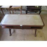 A reproduction leather inset top table with drawer